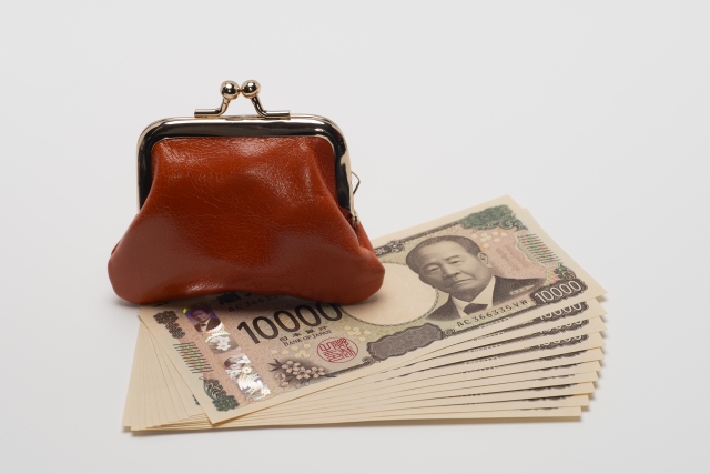 新紙幣の一万円とがま口財布のイメージ